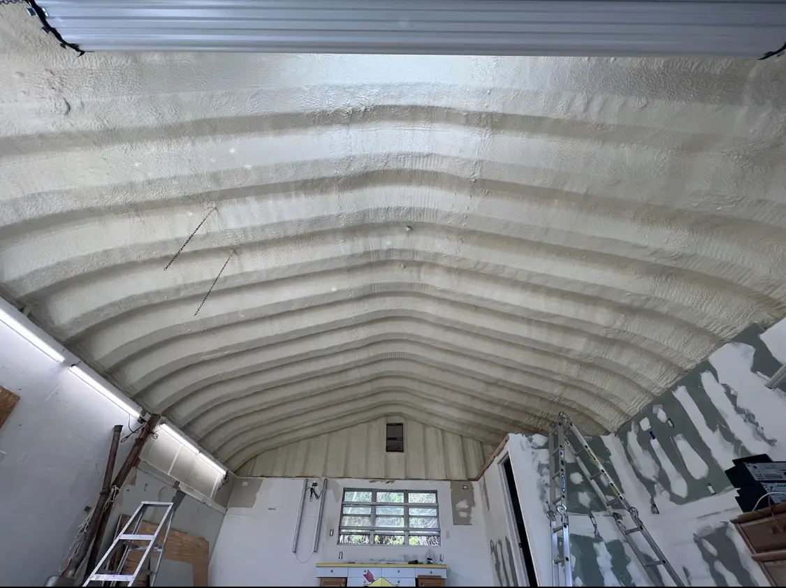 Spray polyurethane foam applied to the underside of a metal roof deck in Spanish Fork